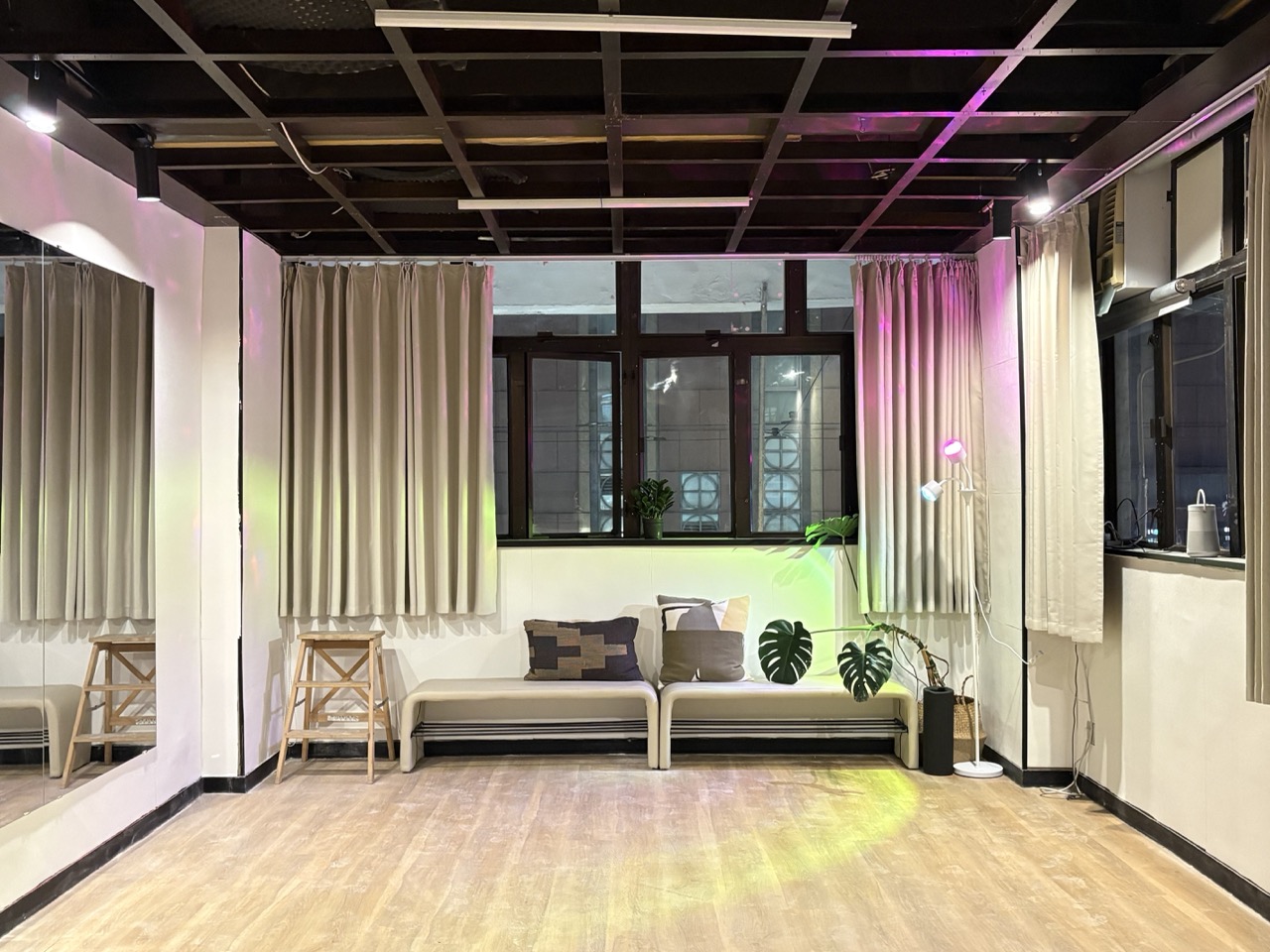 The Zouk Haus studio with mirrors, curtains and wooden floor